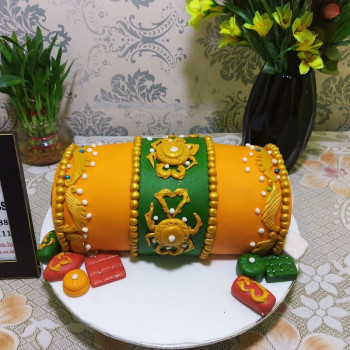 Orange Dhol Shape Fondant Cake